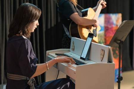 Musician plays keyboard