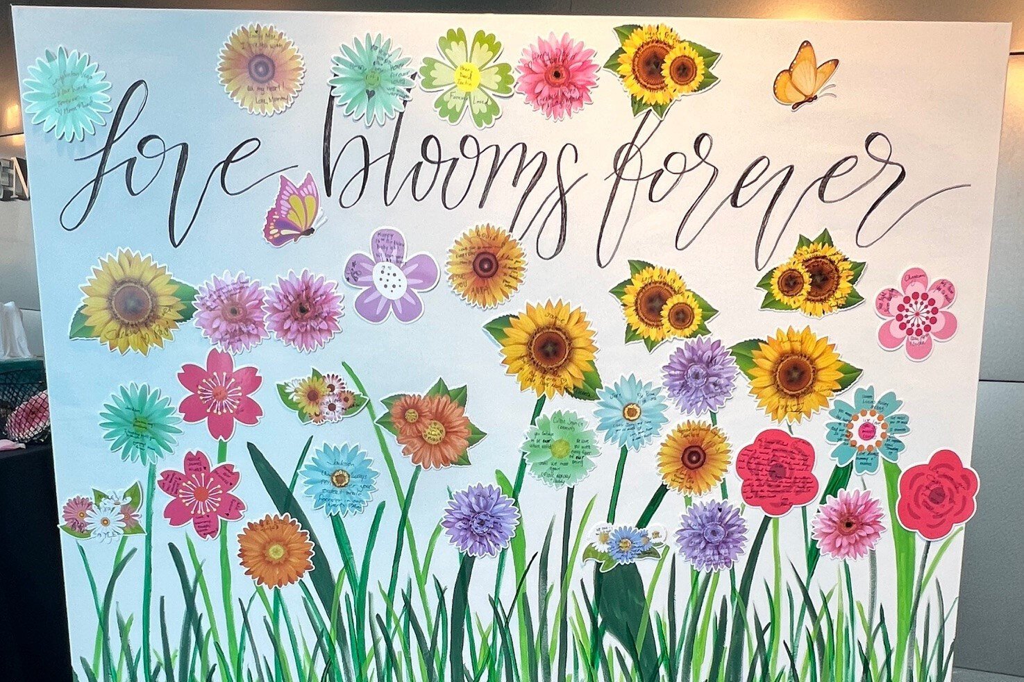 Sign reads: "Love blooms forever"